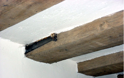 L-tie holds the joist in place